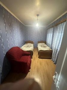 Postel nebo postele na pokoji v ubytování Guesthouse LALI GULEDANI