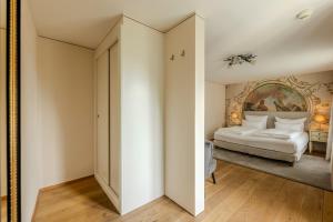 Łóżko lub łóżka w pokoju w obiekcie Boutiquehotel Amadeus
