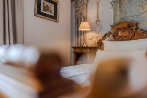 Łóżko lub łóżka w pokoju w obiekcie Boutiquehotel Amadeus