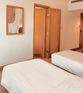 Postelja oz. postelje v sobi nastanitve Ramada Hong Kong Grand View