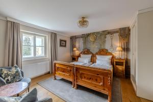 Łóżko lub łóżka w pokoju w obiekcie Boutiquehotel Amadeus