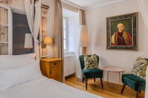 Łóżko lub łóżka w pokoju w obiekcie Boutiquehotel Amadeus