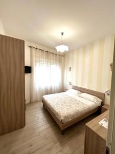 A bed or beds in a room at La Boa B&B