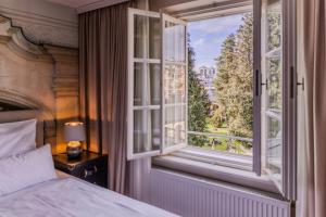 Łóżko lub łóżka w pokoju w obiekcie Boutiquehotel Amadeus