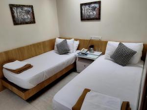 Postel nebo postele na pokoji v ubytování Empire Hotel + 4 fotografie