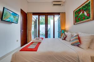 Ένα ή περισσότερα κρεβάτια σε δωμάτιο στο Villa Ganesha 2BR with Private Pool - Canggu +25 φωτογραφίες