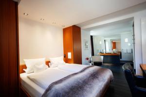 Ein Bett oder Betten in einem Zimmer der Unterkunft Hotel Antoniushütte