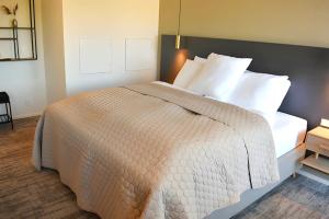 Postel nebo postele na pokoji v ubytování Hotel Kerteminde Strand