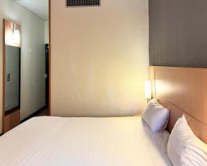 Postel nebo postele na pokoji v ubytování a&o Hostel Milano Ca Granda