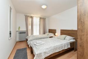 Katil atau katil-katil dalam bilik di Apartment Biserka 2240