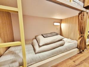 Postel nebo postele na pokoji v ubytování Onjeong Stay