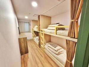 Postel nebo postele na pokoji v ubytování Onjeong Stay