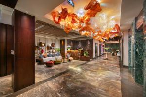 a lobby of a hotel with a chandelier at HOTEL de LAGOM in Hanoi
