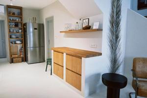 a kitchen with a counter and a refrigerator at Villa Ines in Komiža