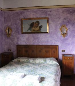 Postel nebo postele na pokoji v ubytování Agriturismo La Grotta Di Montecchino