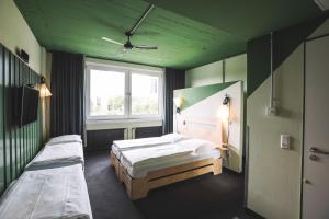 Voodi või voodid majutusasutuse Superbude Hamburg St Georg toas
