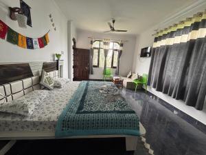 a bedroom with a bed and a pool at Sunrise home stay in Khajjiar  +44 photos
