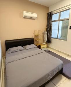 Katil atau katil-katil dalam bilik di Taiping Centre Point Suite 9 by BWC