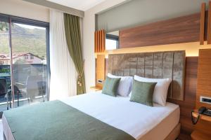 Ένα ή περισσότερα κρεβάτια σε δωμάτιο στο Hotel Oliva Verde +13 φωτογραφίες