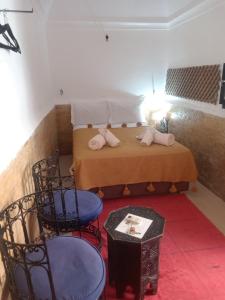 Postel nebo postele na pokoji v ubytování Riad Dar Lilas