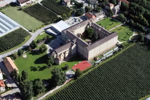 an overhead view of a large building with a field of vines at Bischöfliches Institut Vinzentinum in Bressanone