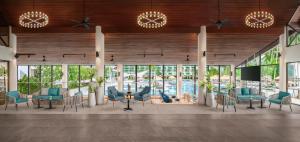 a rendering of a lobby with chairs and tables at Le Meridien Phuket Beach Resort in Karon Beach