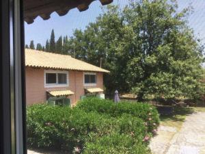 a view of a house from a window at Harmony House Corfu in Kynopiástai