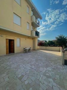 a patio in front of a building at La casa di Ale in Pineto +15 photos