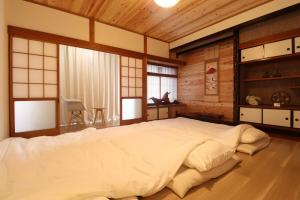 Postel nebo postele na pokoji v ubytování Value Residence Hotel 西之表