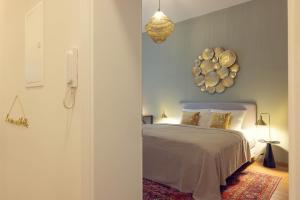 a bedroom with a bed with areath on the wall at LeonArt Living 12 in Graz
