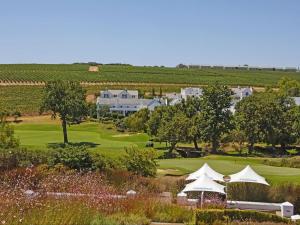 an aerial view of a golf course with a house at Winelands Golf Lodges 4 in Stellenbosch