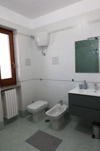 a white bathroom with a toilet and a sink at B&B Da Fifi in Castel San Giorgio +14 photos
