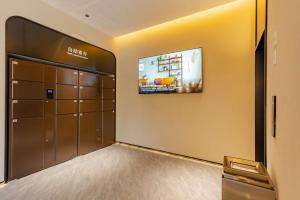 Postel nebo postele na pokoji v ubytování Tingxi Hotel + 37 fotografií