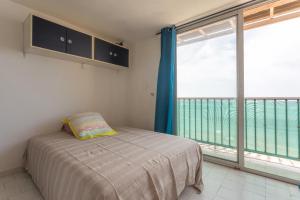 Postel nebo postele na pokoji v ubytování Porte Rouge 2