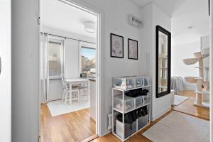 a room with a hallway with a mirror and a table at Apartament u Ann in Grzędzice