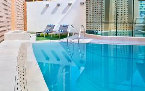The swimming pool at or close to Staybridge Suites - Doha Lusail by IHG