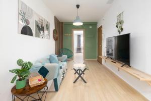 Μια τηλεόραση ή/και κέντρο ψυχαγωγίας στο Stylish Two-Bedroom Flat in Burriana