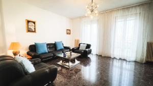 a living room with a couch and a table at Canal Bellavista by Ca-Sa Check in Chioggia +49 photos