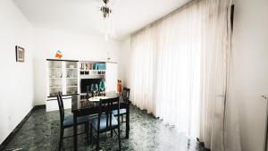 a dining room with a table and chairs at Canal Bellavista by Ca-Sa Check in Chioggia +45 photos