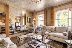 a living room with couches and a dining room at Stylishly Designed Private Home in Central Windsor in Windsor