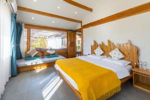 Ένα ή περισσότερα κρεβάτια σε δωμάτιο στο Yiho Inn