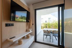 Μια τηλεόραση ή/και κέντρο ψυχαγωγίας στο As Casas do Castro "Iroite"