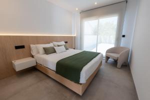 Ένα ή περισσότερα κρεβάτια σε δωμάτιο στο As Casas do Castro "Tahume"
