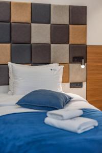 Postel nebo postele na pokoji v ubytování Hotel Garni VIZURA Sport