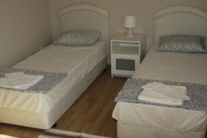 A bed or beds in a room at Complex Fretly