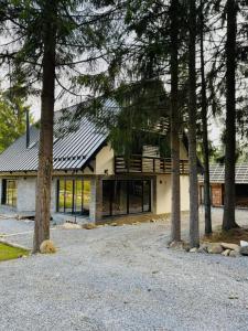 a house with solar panels on the roof at Cabana Bradul Adelinei in Bucsin