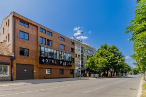 an empty street in front of a hotel room at Hotel Garni VIZURA Sport in Belgrade