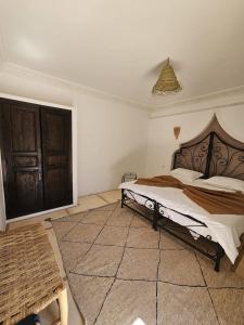 a bedroom with a large bed in a room at Villa 4 chambres avec grande piscine privée in Marrakech +15 photos