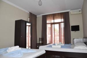 Letto o letti in una camera di Hotel Sunny Coast