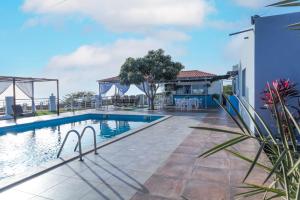 an image of a swimming pool at a house at Hotel Pousada Venus in São Filipe